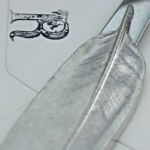 Feather letter opener.